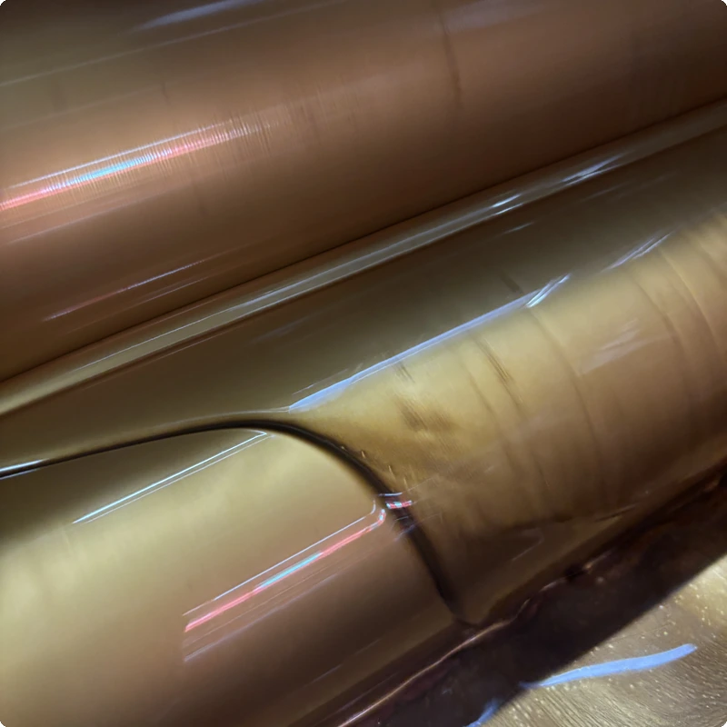 Gravure printing press with metallic gold ink and rotating engraved cylinders — in-house production at DSS Pack factory